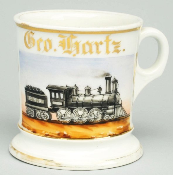 Locomotive Shaving Mug.: Gilded "Geo. Hartz". Germany stamp and signed "Thompson" under base. Condition (Excellent). Size 3 - 3/4" T.