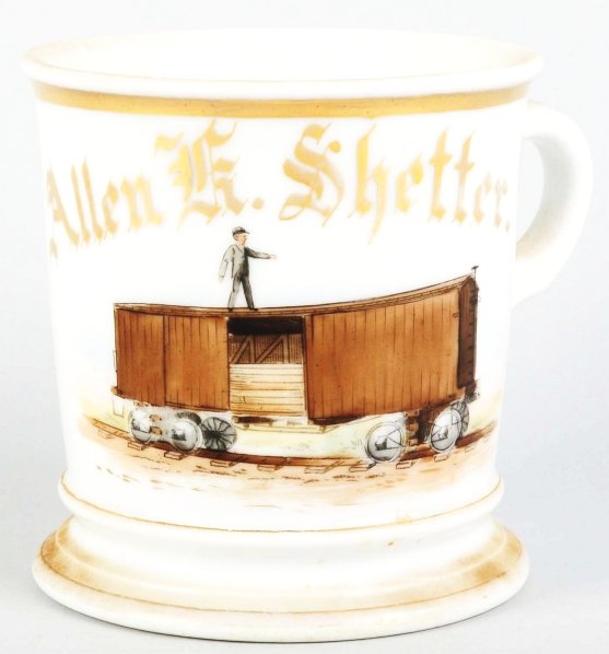 Lumber Car Shaving Mug.: Gilt name "Allen K. Shetter". Image of a man standing atop a train car that is hauling lumber. Nice detail. Stamped "D&C" under base. Condition (Near Mint). Size 4" T.