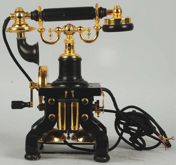 Eiffel Tower Desk Set Telephone.: Circa 1900, beautiful black with gold trim, handset not marked, tear drops in cradle. Condition (Excellent). Size 11 - 3/4" T.