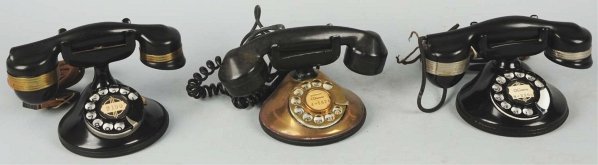 Lot of 3: Automatic Electric 1A Telephones.: Circa 1930, first is black plastic base Highboy with banded handset (no cord). Second is black plastic base with banded handset. Third is brass base with black cradle and later handset. Condition (Exc