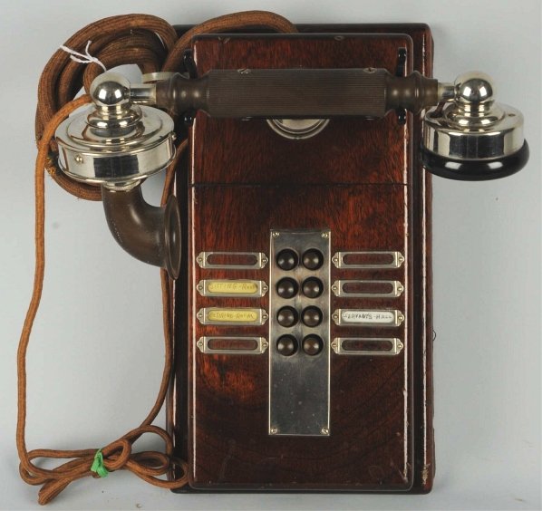 Connecticut Intercom Cradle Telephone.: Circa 1915, walnut with nickeled and black brass cradle and handset, 8-station, marked handset. Condition (Excellent). Size 12 - 1/2" L.