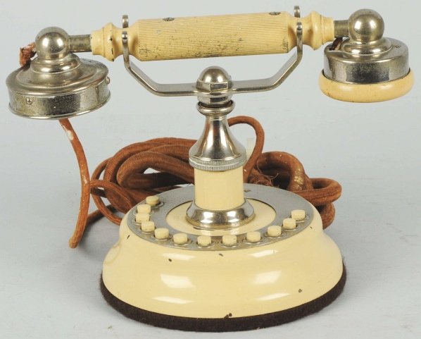 Connecticut 12-Station Cradle Telephone.: Circa 1915, ivory painted metal and nickel plated brass, marked on base, frayed cords. Condition (Excellent). Size 10" W.