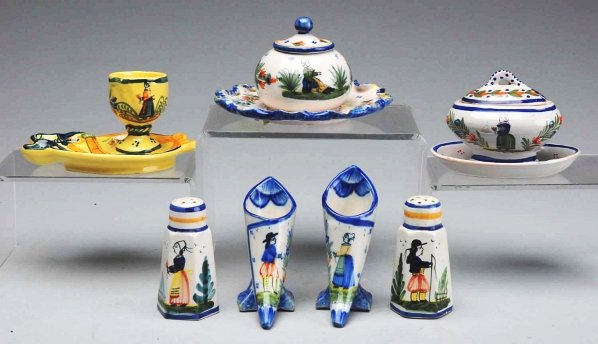 Lot of 7: Pieces of French Quimper Pottery.: Includes salt and pepper shakers, miniature child's covered vegetable, egg cups, and one sugar bowl. Condition (Excellent). Size Largest: 5 - 3/4" Dia.