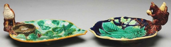 Pair of 19th Century Majolica Trays.: First tray retains its original bird and nest decoration and the second tray retains its original squirrel and nut. Bird has a repaired tail and the squirrel tray has one rim chip. Condition (Excellen