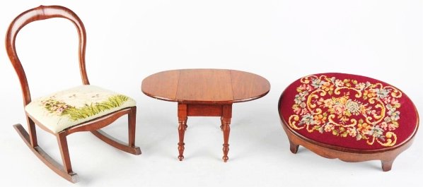 Lot of 3: Child's Furniture Items.: Includes one needlepoint rocker, one drop leaf table, and one needlepoint stool. Condition (Excellent). Size Largest: 19" T.