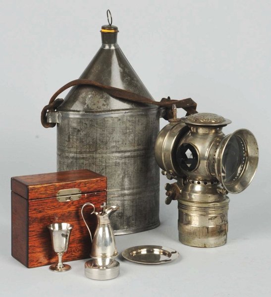 Lot of 3: Assorted Items.: Includes one Badger bike light with red faceted inserts and dated "1896", one tin canteen with cork stopper and leather strap, and one Holy Communion set in original wooden box. Condition (Excellent).