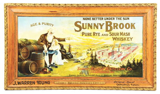 TIN SUNNY BROOK WHISKEY SIGN W/ FACTORY & WHISKEY BARREL GRAPHICS.: SST. A nice example of this colorful sign from Sunny Brook Whiskey, featuring colorful graphics with an original wood embellished frame. CONDITION: The field of this sign shows areas of wear and sligh
