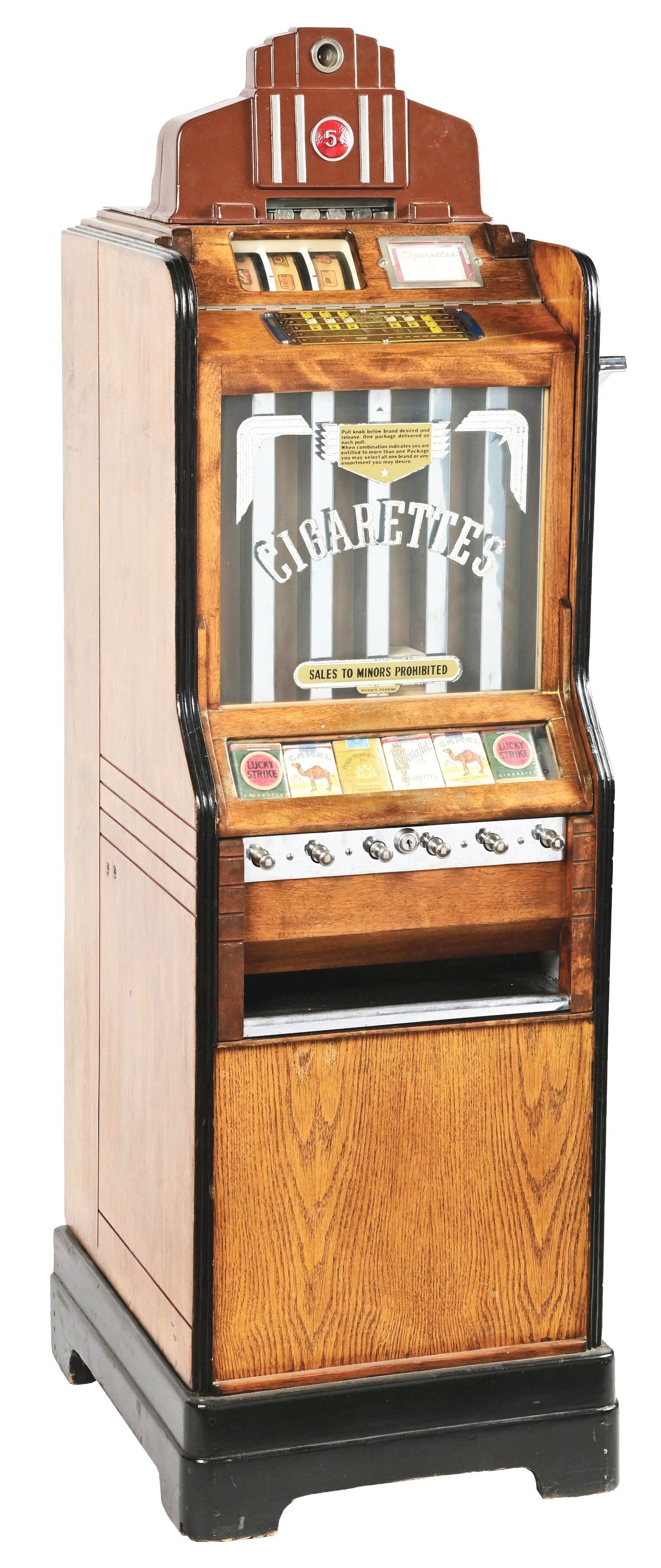 5¢ O.D. JENNINGS CIGA-ROLA FLOOR MODEL SLOT MACHINE.: C. 1937. O.D. Jennings Company, Chicago IL. This machine offers the operator the choice between purchasing a pack of cigarettes with or without a gambling element, serving as a cigarette vending machi