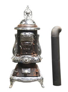 NUBIAN HOT BLAST CAST IRON WOOD STOVE W/ CHROME-PLATED.: Wonderful original cast iron wood stove. Some rust, consistent with age, does not detract from attractive overall appearance. Very ornate-looking and nice detail on the chrome parts. This is not a sta