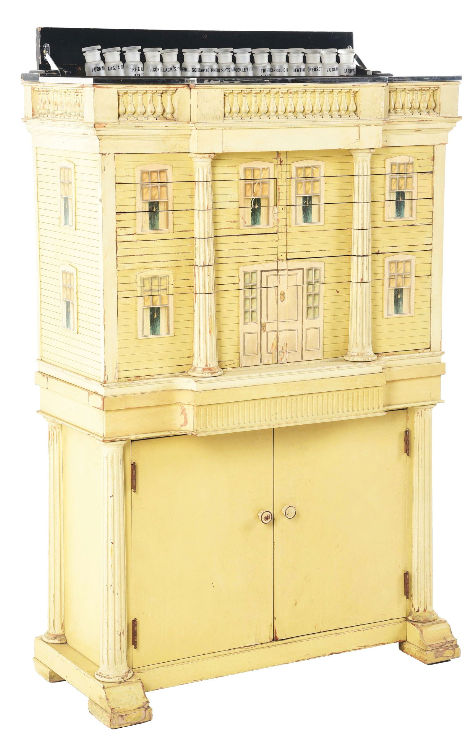 CHILDREN'S DOLL HOUSE DENTAL TOOLS STORAGE CABINET.: C. 1940. Very unusual dental cabinet with an overlay wooden detail of a doll house. This is not a contemporary cabinet; it has age and is complete with all the drawers. Would make a great storage cabi