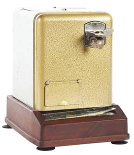 5¢ MILLS VEST POCKET SLOT MACHINE WITH ADDED CASH BOX.: The Mills Novelty Co. Vest pocket slot machine in original paint with the added feature of a wooden cash box base. CONDITION: All original paint, working and paying. An interesting example of this dem