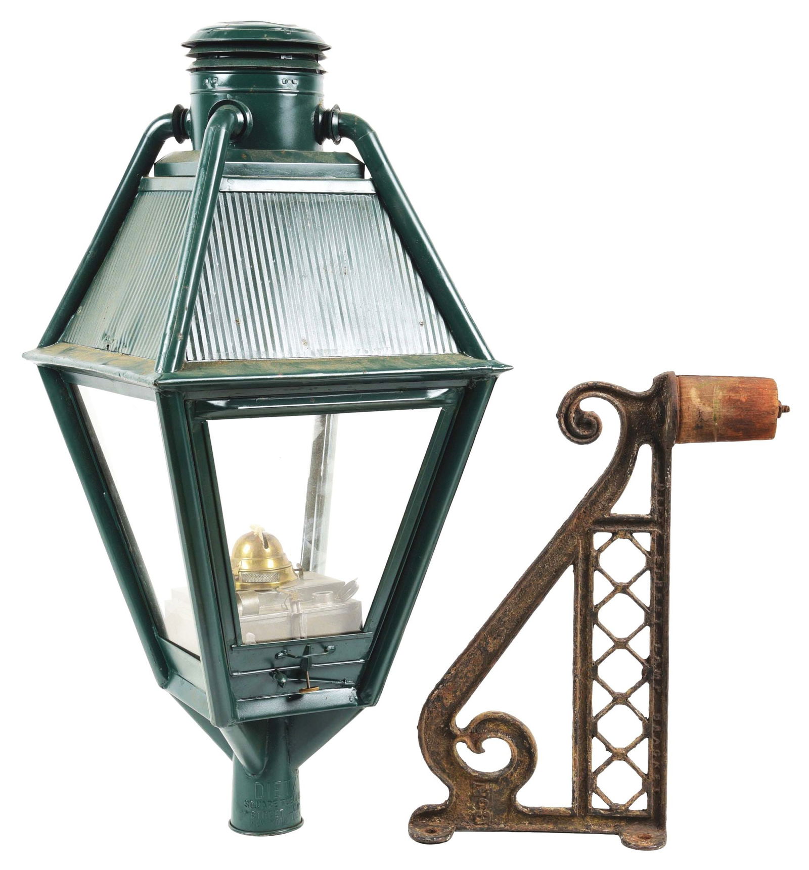 DIETZ STREET LAMP W/ BRACKET.: A four-sided cold-blast Dietz square tubular street lamp (hallmarked on the mounting socket). Unit is complete with glass and the correct fount and burner unit. Lamp shows newer green paint, similar t