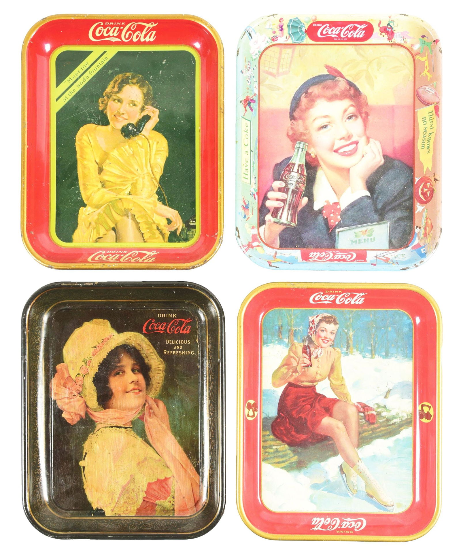 LOT OF 4: COCA-COLA TRAYS.: (A) Winter scene with a woman ice skating. Dated 1941. (B) Early Coca-Cola woman. CONDITION: The tray has been clear-coated. (C) The menu woman holding a Coke product. (D) Fountain woman on the teleph