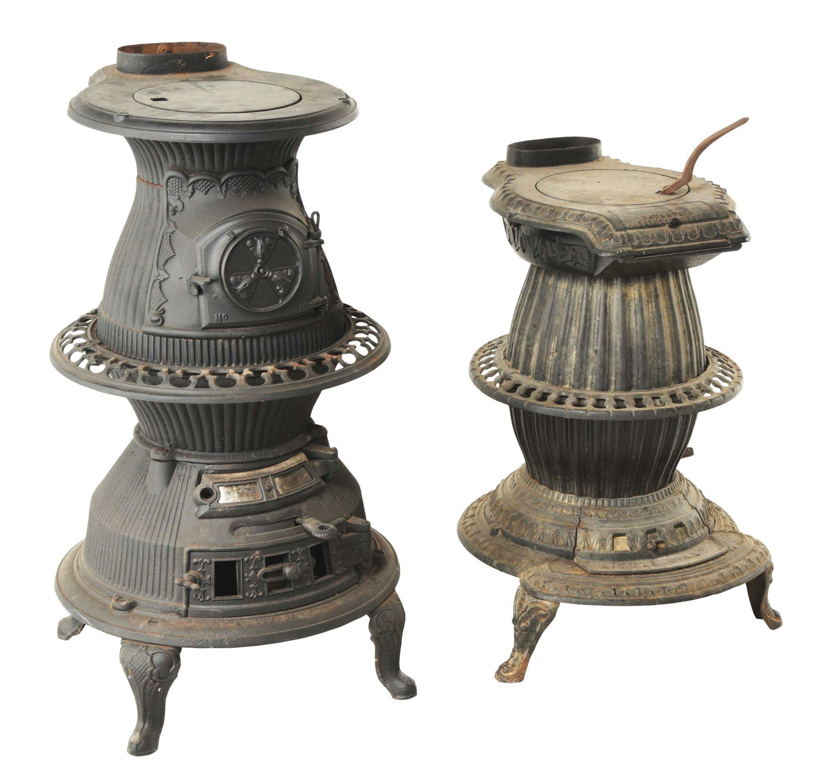 PAIR OF WONDERFUL EARLY POTBELLY STOVES.: This is a pair of wonderful early potbelly stoves. (A) Sun-Beam no. 12 stove, manufactured by J. Spear Co., Philadelphia, PA. A beautiful larger-size potbelly stove with original skirting, original do
