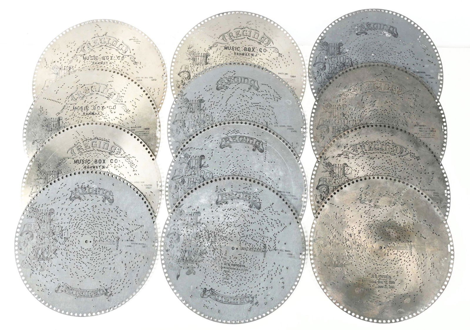 LOT OF 24: 15 - 1/2" REGINA MUSIC BOX DISCS. (1 of 2)