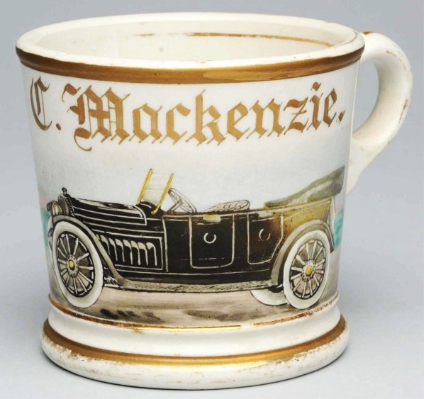 Automobile Shaving Mug.: Gilt name "C. Mackenzie". Signed "SP" under base. Nice image of an open air auto with minor wear. Condition (Excellent). Size 3 - 1/2" T.