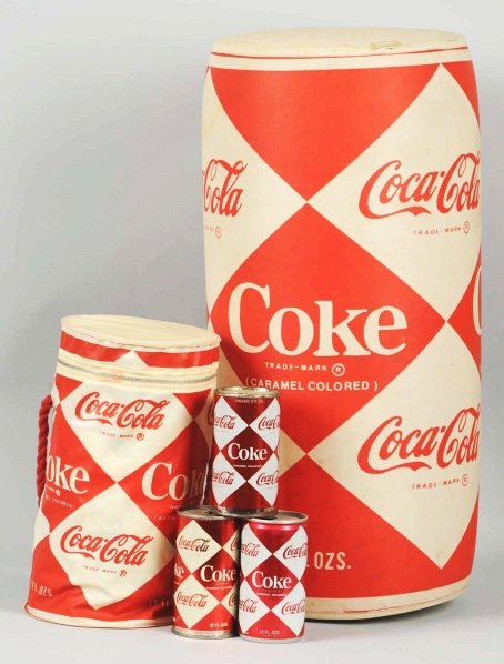 Coca-Cola Diamond Can Lot of 5 Pieces.: Three cans, including one that is unopened, an inflatable display can, and a vinyl zippered can case. 1960s, with moderate wear/soiling. Condition (Excellent). Size Largest: 23" T.