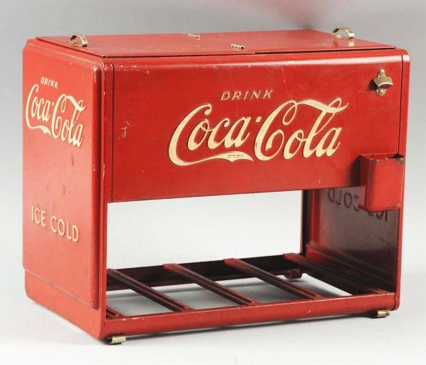 1939 Coca-Cola Salesman's Sample Cooler.: Complete with books and gaskets, though some of each are dislodged. A few shallow dents only, with moderate wear and soiling. Small nicks and scratches. Condition (Very Good). Size 12 - 1/4" x 9 - 3/4