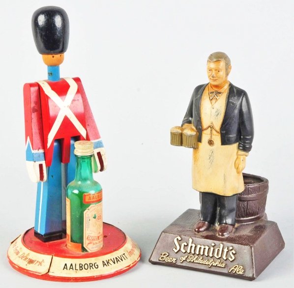 Lot of 2: Back Bar Advertising Figures.: 1940s. Includes Aalborg and Schmidt's. Condition (Excellent). Size Largest: 10" T.