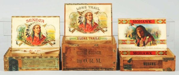 Lot of 3: Indian Men Cigar Boxes.: Circa 1900s. Inner titles include "Seneca", "Lone Trail", and "Mohawk". All images are of Indian men; two with full headdresses and one without. Condition (Good - Very Good). Size Largest: 8 - 1/8" L.