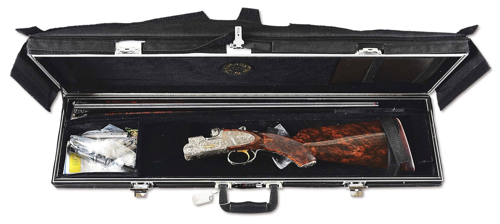 (M) CSMC A-10 AMERICAN 12 GAUGE OVER/UNDER SHOTGUN WITH CAME SCENES BY ROCCO CAPECE.: Mono-bloc barrels are fit with a red plastic forebead on a broadway ventilated rib with machine cut matting. Top barrel with A-10 American designation and notation for 2 - 3/4" and 3" shells on left, 