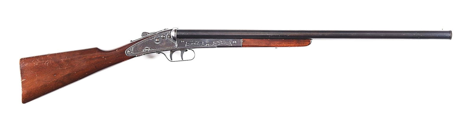 DAISY NO. 104 DOUBLE BARREL BB GUN.: Very scarce Daisy No. 104 break-open BB rifle made by Daisy Manufacturing Company, Plymouth, Michigan, between 1940 and 1941. 24" blued barrels with etched blued receiver, showing dog and bird scene w