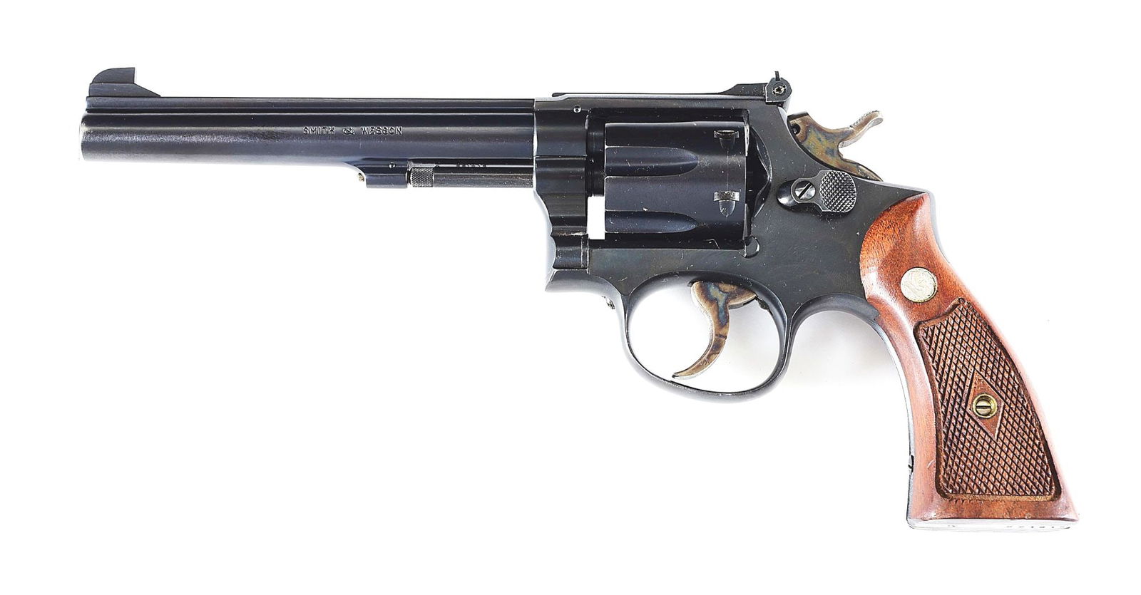 (C) FINE AND SCARCE SMITH & WESSON K-32 MASTERPIECE REVOLVER WITH GOLD BOX.: Only 3630 Post War K-32s, including Model 16s, were manufactured. This scarce Pre-Model 16 was built circa 1954. Blued finish with case hardened trigger and hammer. 6" pinned barrel with matted rib, p