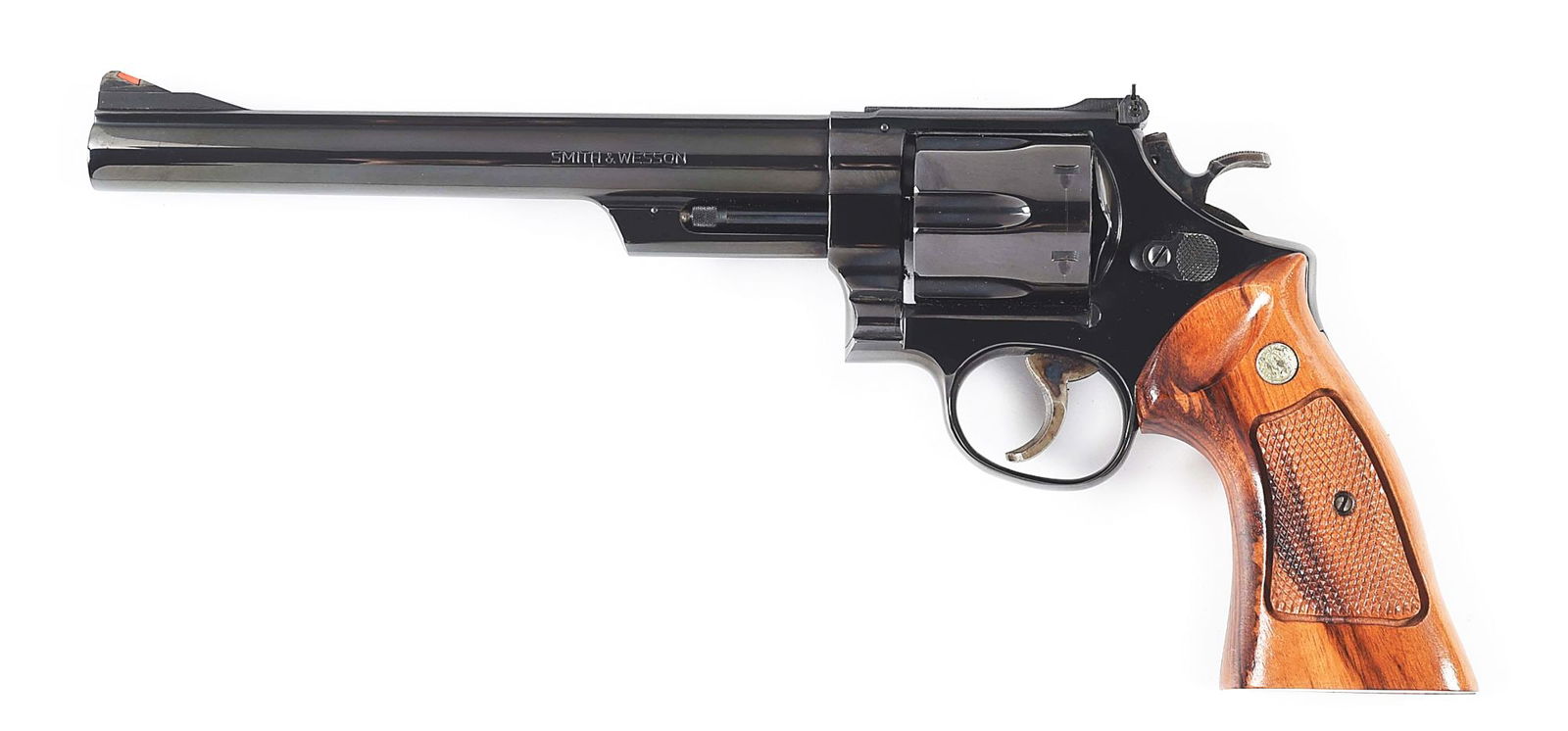 (M) SMITH & WESSON MODEL 29-2 DOUBLE ACTION REVOLVER WITH CASE.: Made by Smith and Wesson circa 1977 with blued 8 - 3/8" ribbed barrel, standard sights, blued frame, and checkered S&W walnut grips in fitted factory blue felt lined box with accessories. CONDITION: E