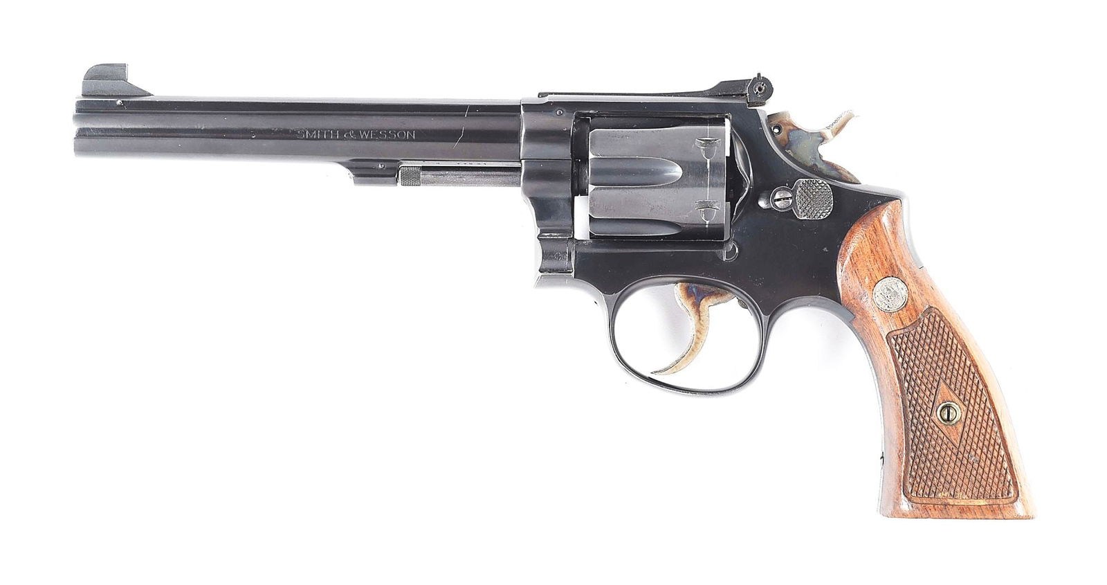 (C) SMITH & WESSON K-38 TARGET MASTERPIECE PRE-MODEL 14 DOUBLE ACTION REVOLVER.: Circa 1949. Full blued finish with case hardened trigger and hammer. Pinned barrel with matted rib, partridge front sight, and micrometer click rear sight. 2-piece diamond checkered grips with S&W med