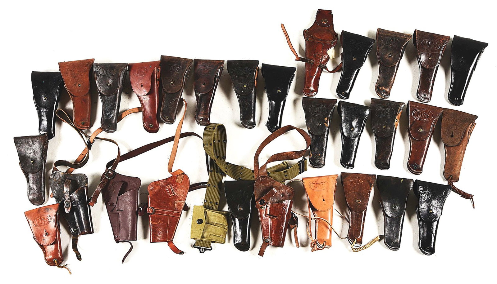 LARGE LOT OF US WWI-WWII M1916 HOLSTERS AND SHOULDER HOLSTERS.: Large lot of World War I-World War II M1916 holsters for the M1911 pistol. Most of the holsters are marked by manufacturers with WWI-WWII wartime dates, however there are a few post-WWII examples mixe