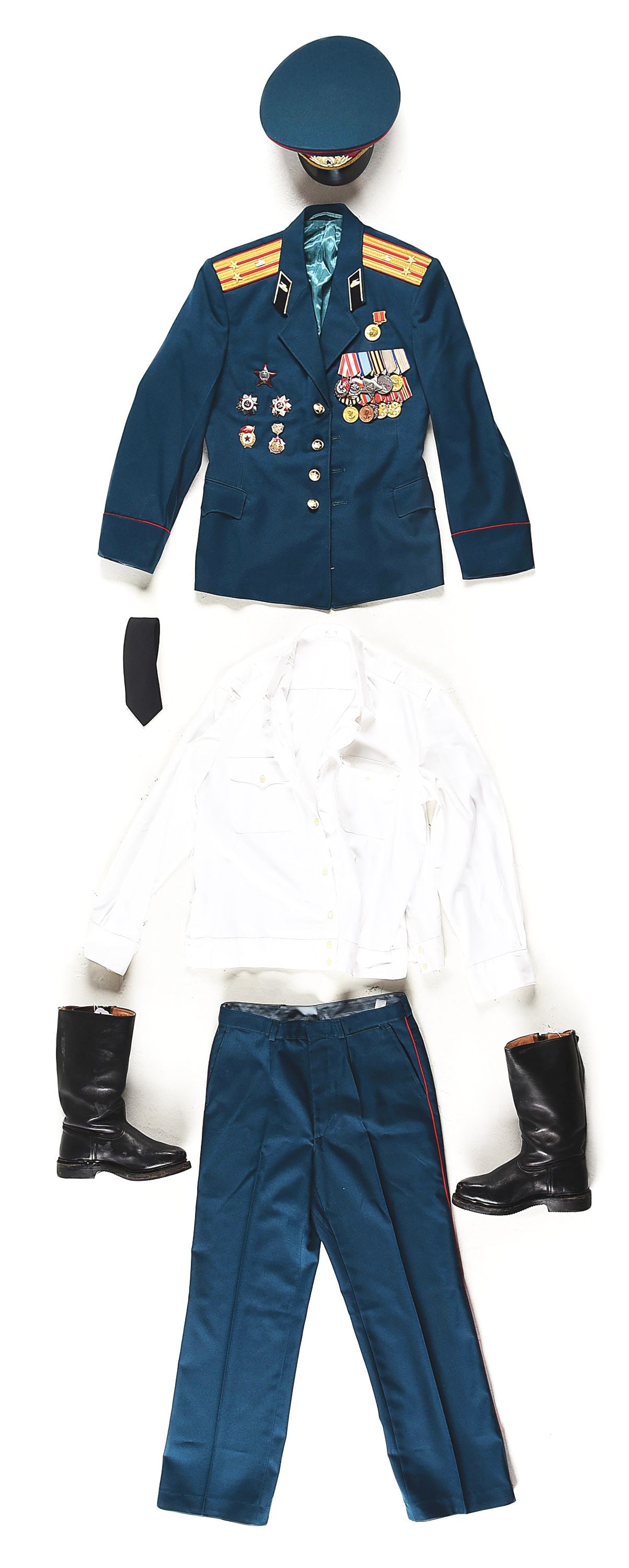 SOVIET COLD WAR LIEUTENANT COLONEL TANKER PARADE UNIFORM.: Cold War Russian lieutenant colonel parade uniform including double-breasted tunic, trousers, visor hat, and boots. The double-breasted dress tunic is off blue wool cloth with red piping around the sh