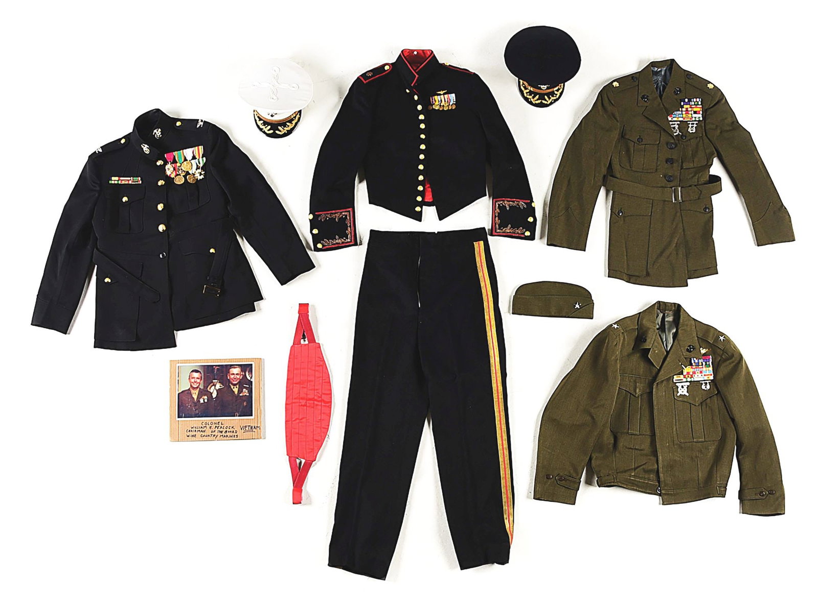 LOT OF 4: US MARINE CORPS DECORATED OFFICER'S UNIFORMS.: Lot consists of: (A) US Marine Corps dress blue officer's uniform with colonel rank and 8 medals which reflect service in Vietnam. The uniform is unnamed with an Exchange Uniform Shop, Quantico, Virgi