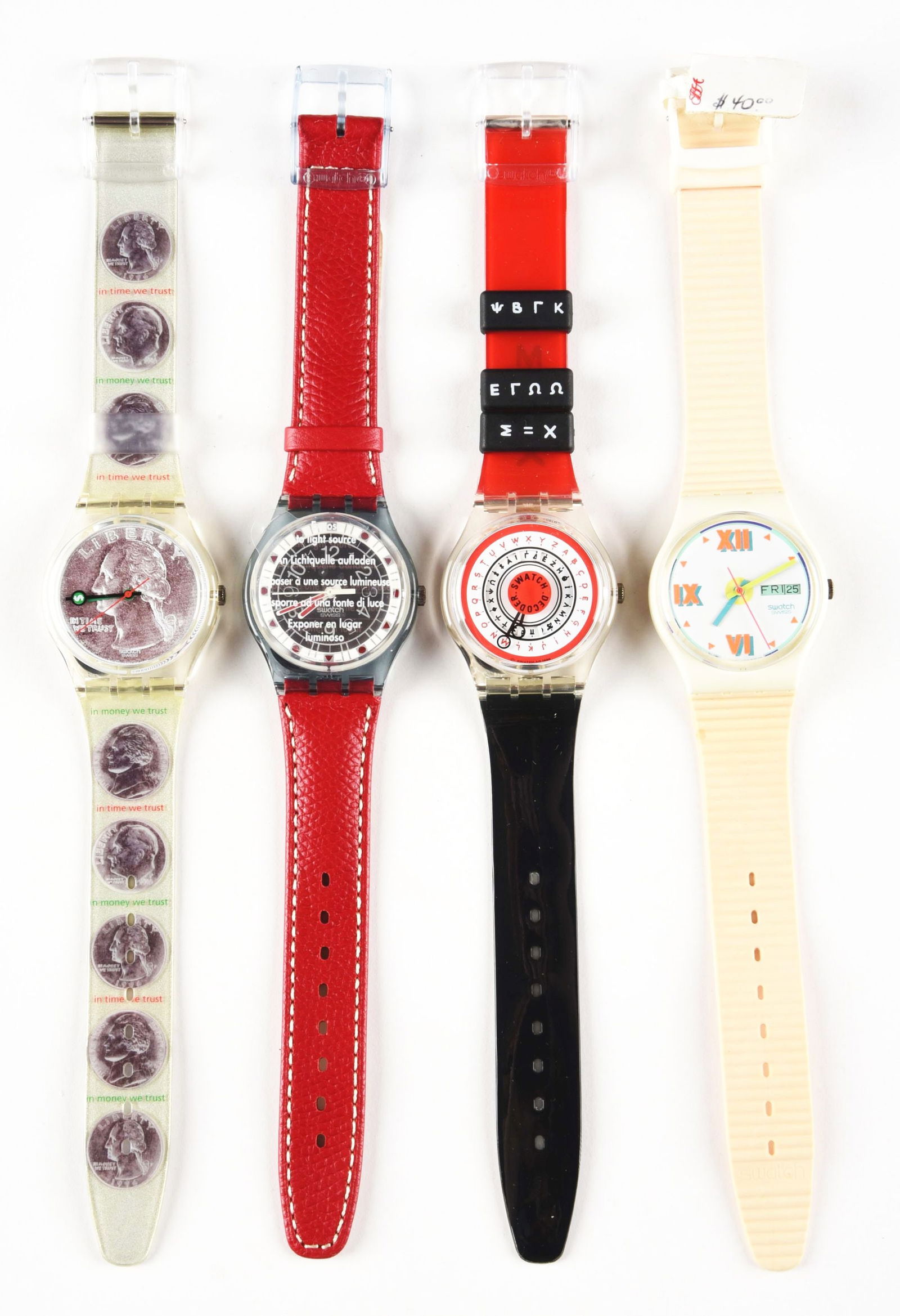 LOT OF 4: ORIGINAL SWATCHES.: (A) GK255 "Sesterce" Standard Gents Swatch Watch. Designed by Enry Lucas. Issued in 1997. (B) SRN101 "Fuoco" Solar Swatch Watch. Issued in 1996. (C) GK720 "Find The Code" Standard Gents Swatch Watch.