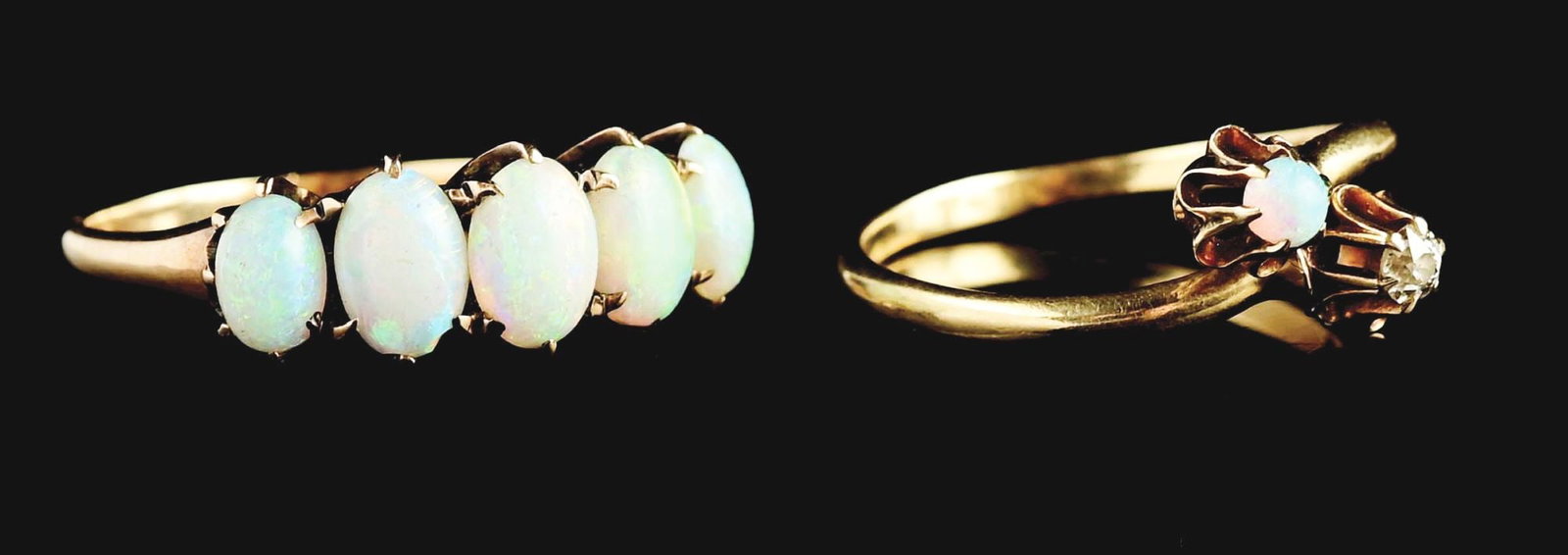 LOT OF 2: ANTIQUE YELLOW GOLD OPAL RINGS.: Lot of 2 antique opal rings. (A) Ladies' yellow gold bypass ring with old mine-cut round diamond and round cabochon opal, marked "14K." Stone with abrasions to surface. Ring size 6, adjustable. Width 