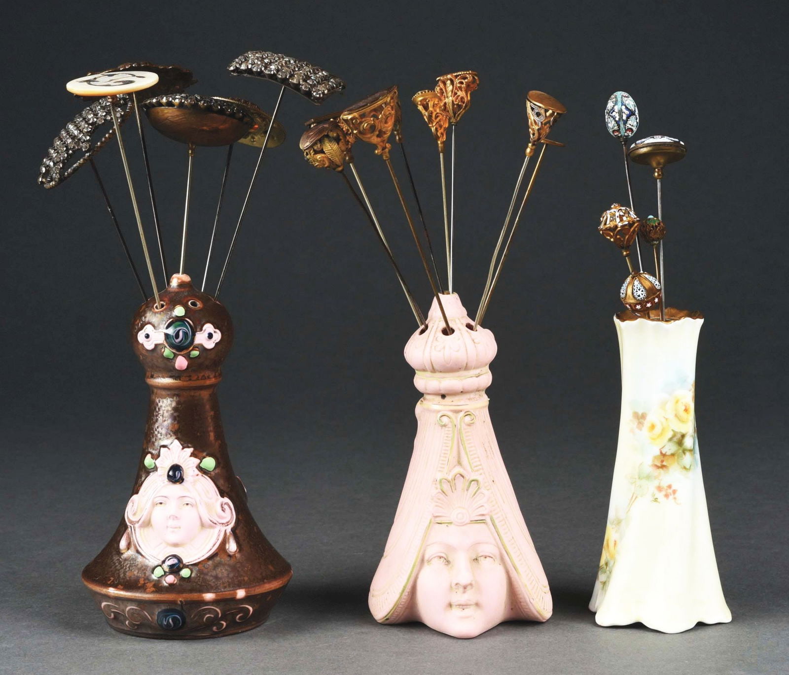 LOT OF OVER 15 ANTIQUE VICTORIAN HATPINS & 3 HOLDERS.: (A) Five hatpins: three micro mosaic and two brass ball with enamel, 5" to 8". Bavaria holder 4 - 7/8" T. (B) Six large top hatpins, 1 - 1/2" to 2" dia.: Art Nouveau head, round set with sapphires, th