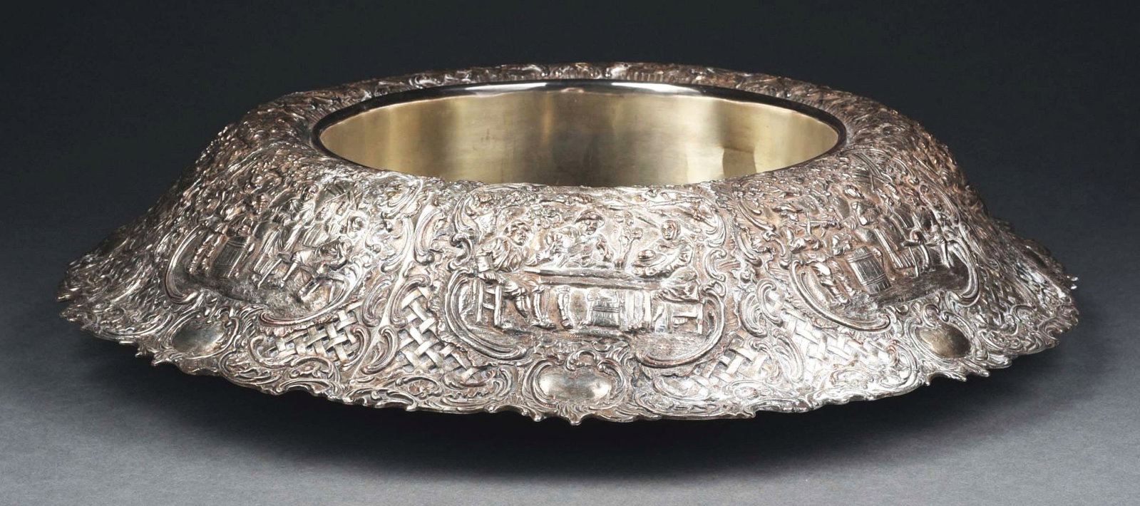 PALACE-SIZE SHEFFIELD REPOUSSE DINING TABLE CENTERPIECE C. 1850.: Large silver plate center bowl, repoussé with tavern scenes. Tests for 40% silver and 40% copper. No damage. Condition: (Excellent). Item Dimensions: 20" Dia.