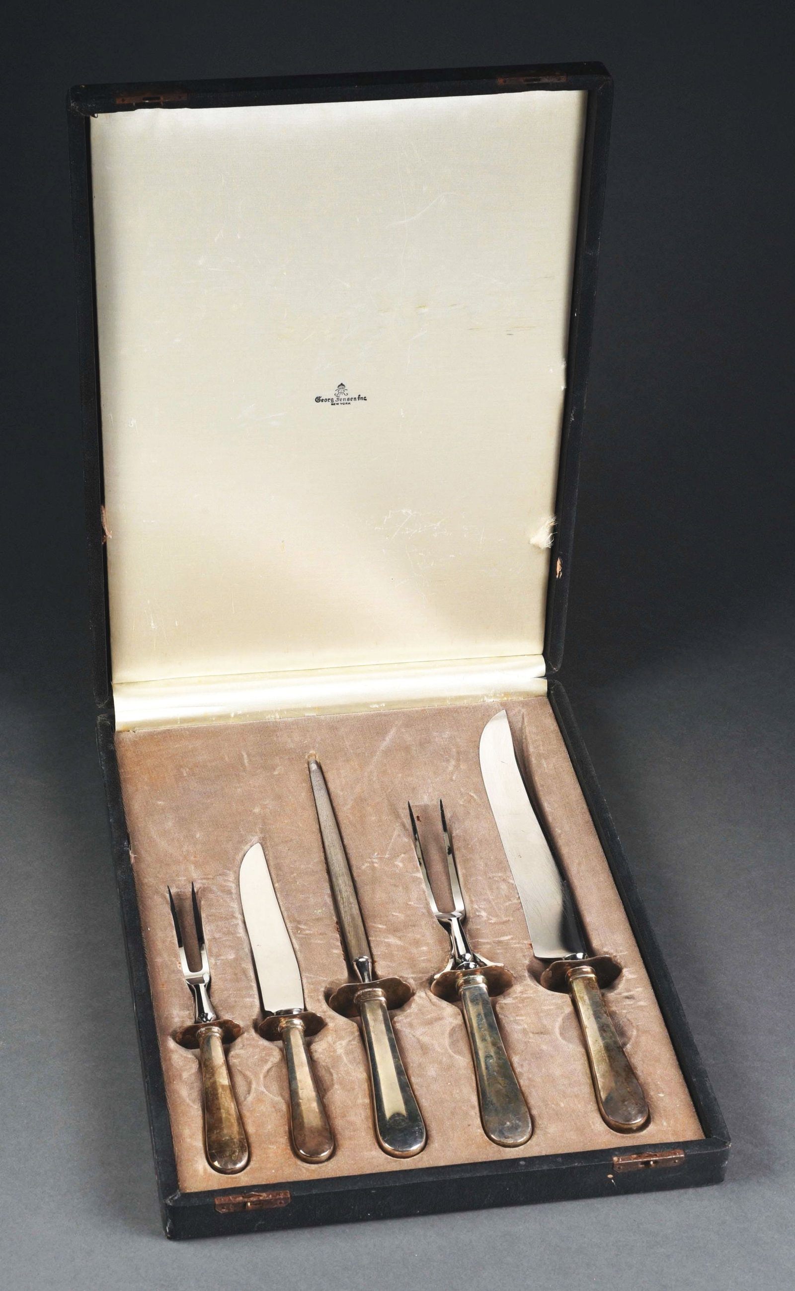 GEORG JENSEN STERLING SILVER 5-PIECE CARVING SET.: Five-piece carving set in fitted case, marked "Georg Jensen." Utensils not signed. Condition: (Excellent). Item Dimensions: Case: 12" x 14 - 1/2" x 2".