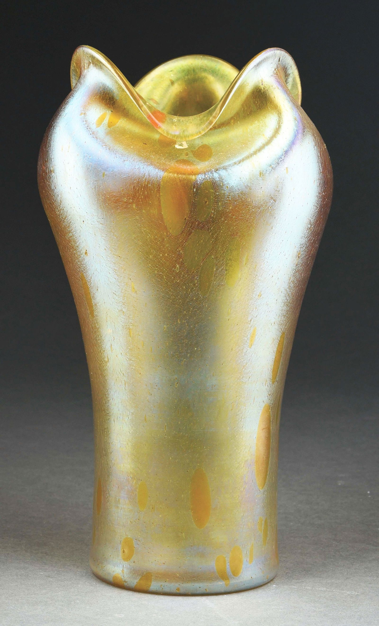 LOETZ ASTRAEA DÉCOR GLASS VASE: A beautiful Astraea glass by Loetz. The 11" tall vase has a three-lobed and pinched mouth. Glass is composed of gold glass with wonderful iridescence and large oil spot pattern. CONDITION: Excellent c