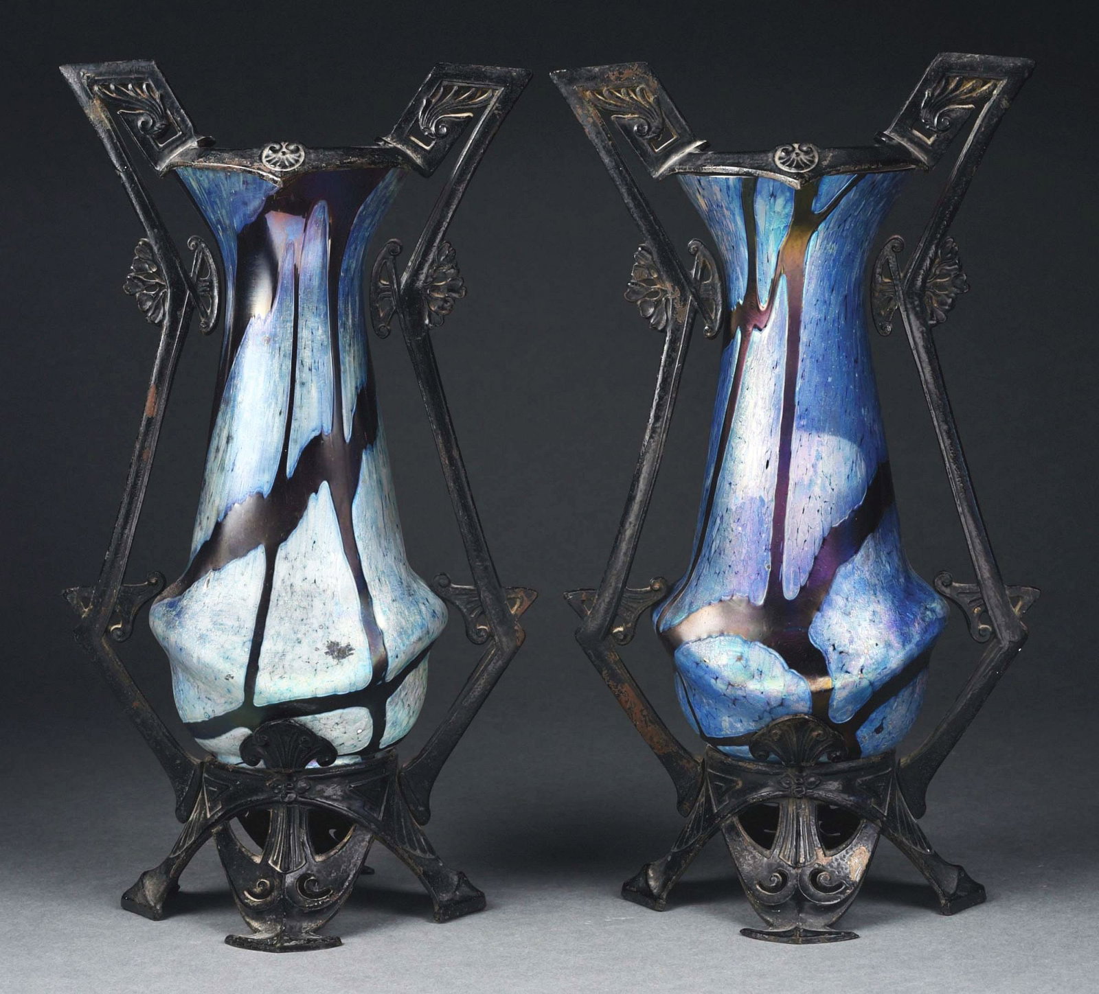 PAIR OF AUSTRIA ART NOUVEAU VASES IN METAL MOUNT.: A beautiful pair of early 20th century Austrian Art Nouveau vases in metal mounts. Each vase stands 14" tall and is composed of beautiful purple glass with abstract Art Nouveau pattern. Vases are high