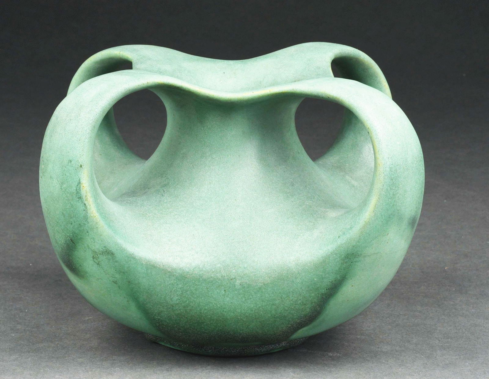 TECO POTTERY 4-HANDLED MATTE GLAZED GREEN VASE DESIGNED BY N. FORESTER.: C. 1910. Impressed double Teco marks on underside. Condition: (Excellent). Item Dimensions: 8 - 1/4" x 8 - 1/4" x 5 - 1/2".
