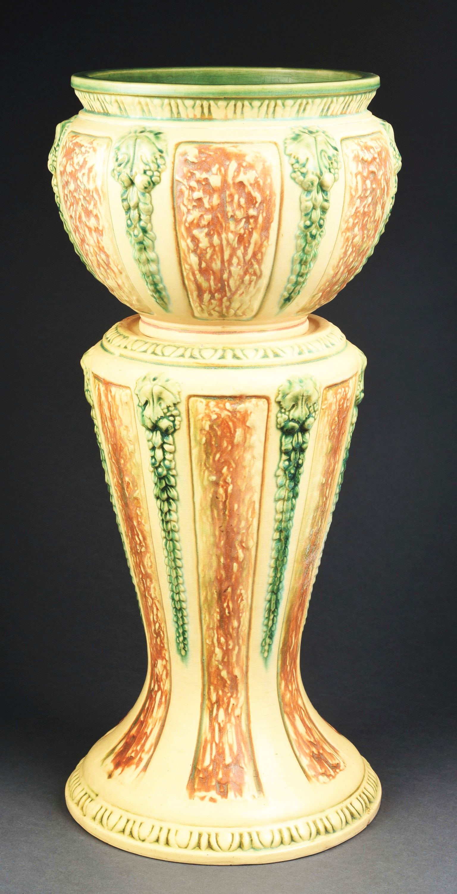 ROSEVILLE POTTERY FLORENTINE JARDINIÈRE & PEDESTAL.: C. 1933. Jardinière 9-1/4"h x 11-5/8"w. Pedestal 19-3/4"h. A few small fleabite chips on base of pedestal and jardinière. Condition: (Very Good). Item Dimensions: 11 - 1/2" x 11 - 1/2" x 29"