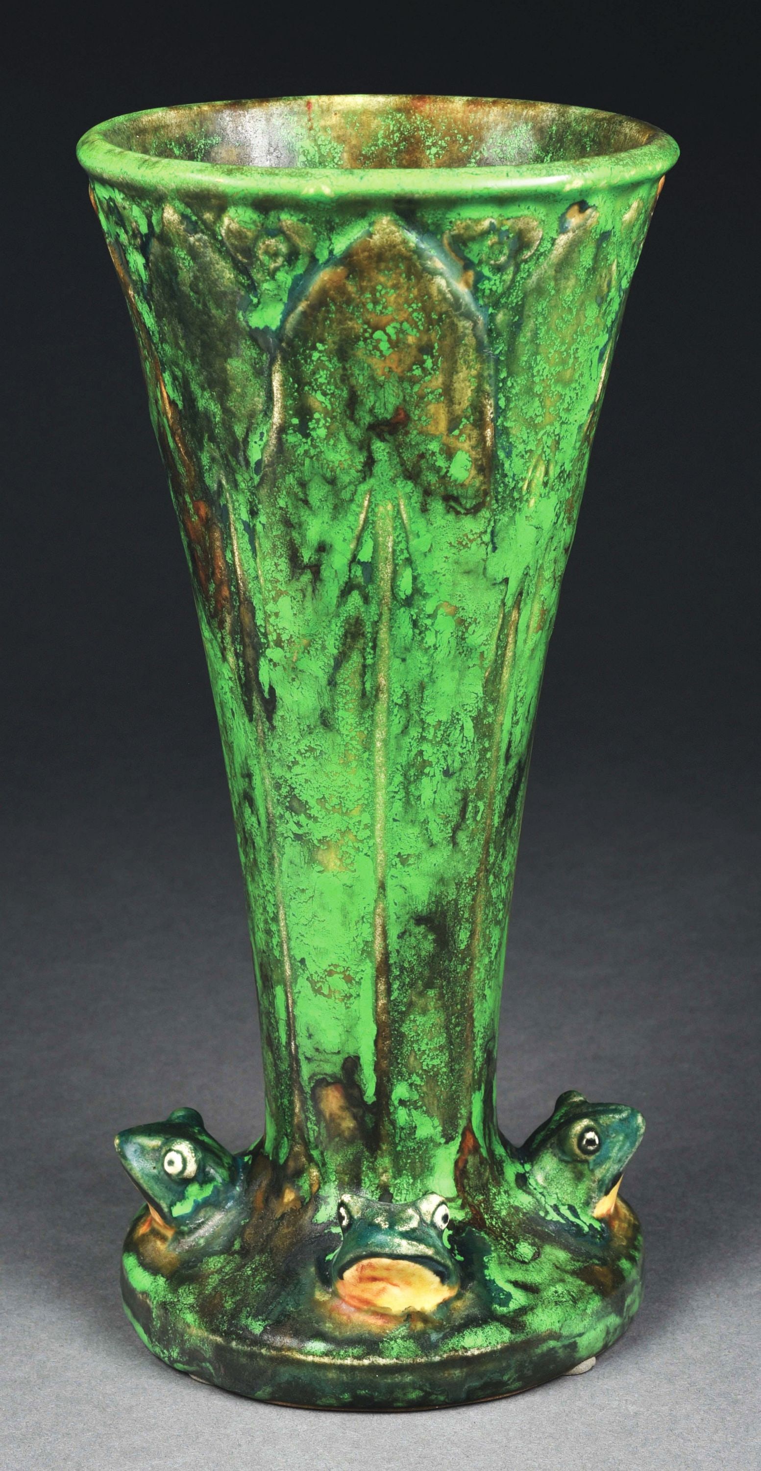WELLER POTTERY "COPPERTONE" VASE.: C. 1920s. Rare vase with four frogs at base with heads above the water. Strong, vibrant glazing. Marked with Weller Pottery ink stamp. Condition: (Excellent). Item Dimensions: 5 - 1/2" x 5 - 1/2" x 11