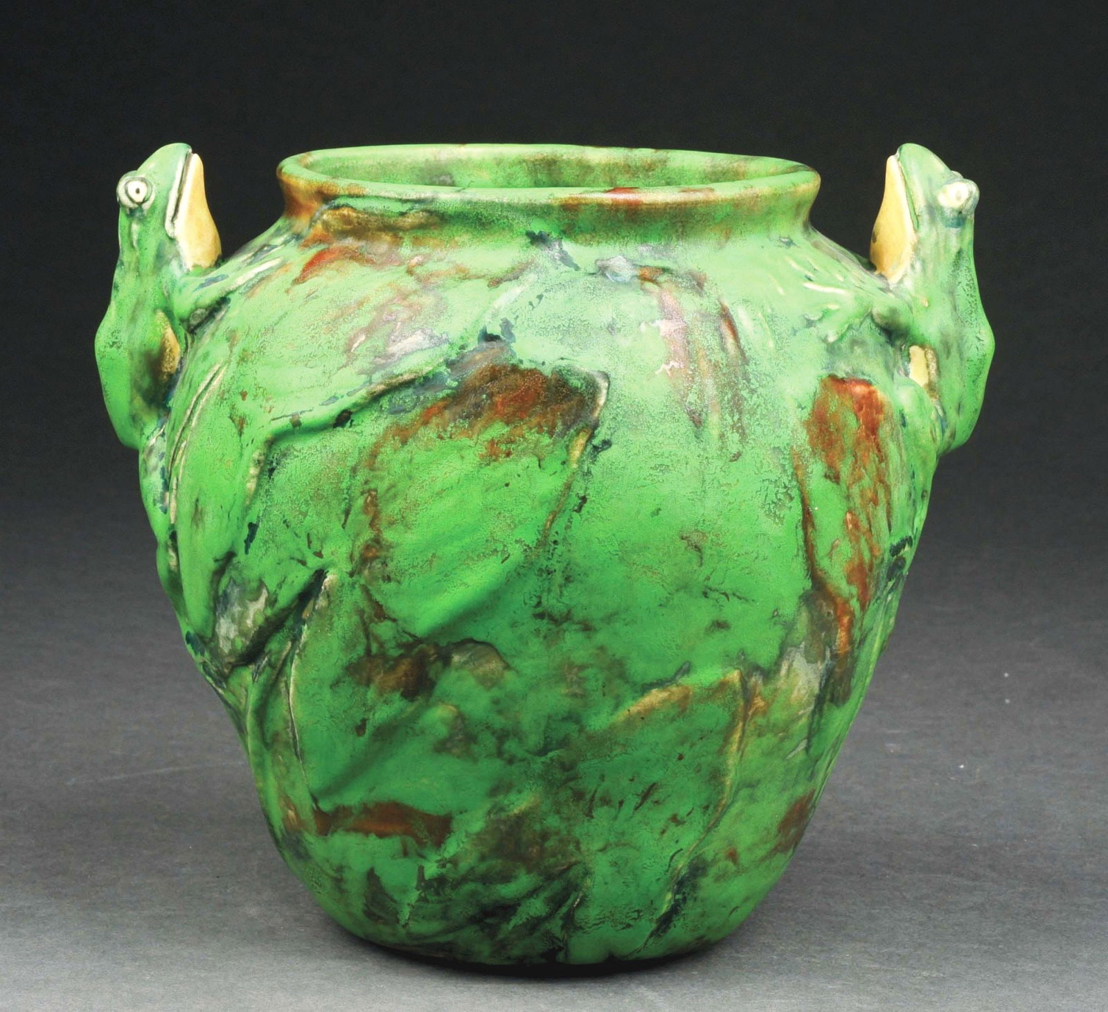 WELLER POTTERY "COPPERTONE" VASE.: C. 1920s. Two frogs looking upwards near rim with strong, vibrant glazing overall. Marked with Weller Pottery ink stamp. Condition: (Excellent). Item Dimensions: 8 - 1/2" x 7" x 8".