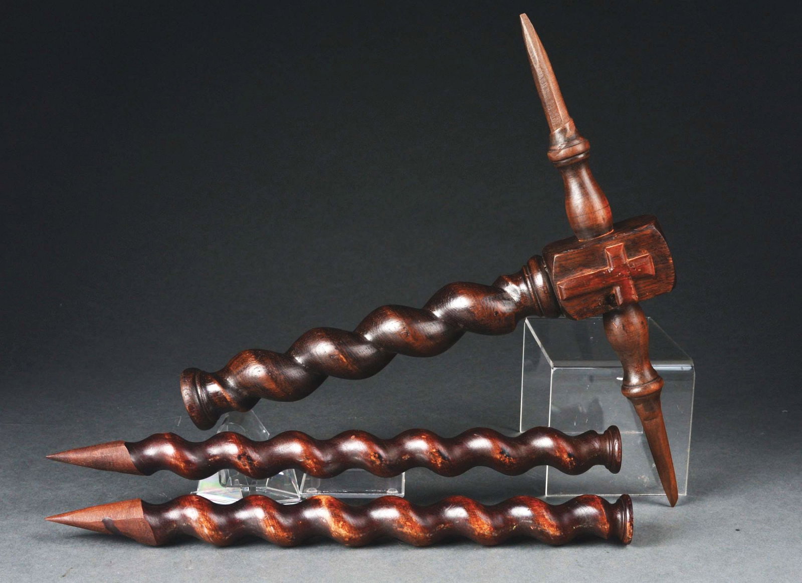 EUROPEAN VAMPIRE HAMMER AND 2 STEAKS WITH WOODEN CROSS.: A great set of three 19th century European vampire killing items. Consists of a polished twisted spindle, looks like walnut wood, hammer with carved cross and 2 stakes. CONDITION: Some minor wood scuf