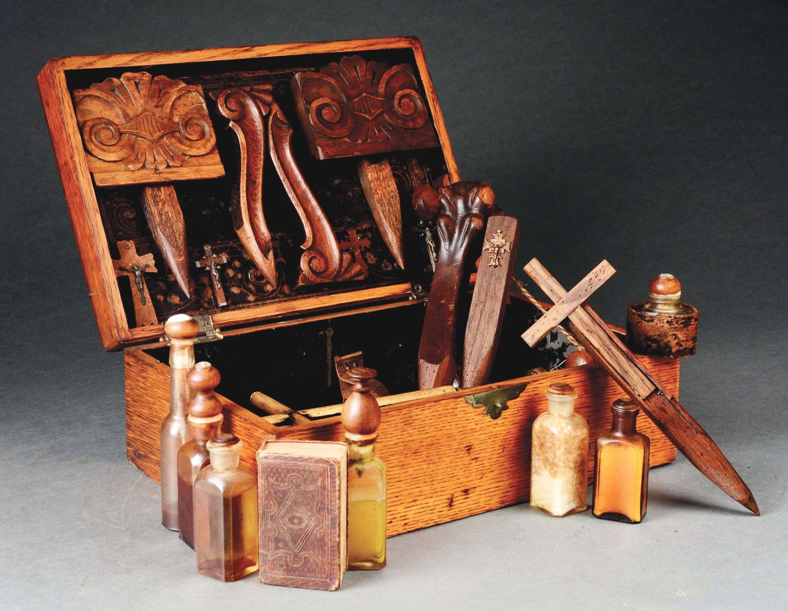 19TH CENTURY EUROPEAN VAMPIRE KILLING KIT.: An antique 19th century Black Forest style European vampire killing kit in a hinged oak wood traveling box. This vampire traveling box consists of various vampire hunting or slaying substances, differ