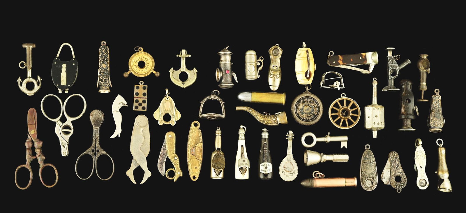 LARGE COLLECTION OF LOOSE MINI CIGAR CUTTERS.: Large collection of fob-style cigar nippers in various figural and utilitarian shapes and sizes. Some silver plate. Condition: (Good-Very Good). Item Dimensions: Largest: 1 - 3/4" x 1 - 1/2".