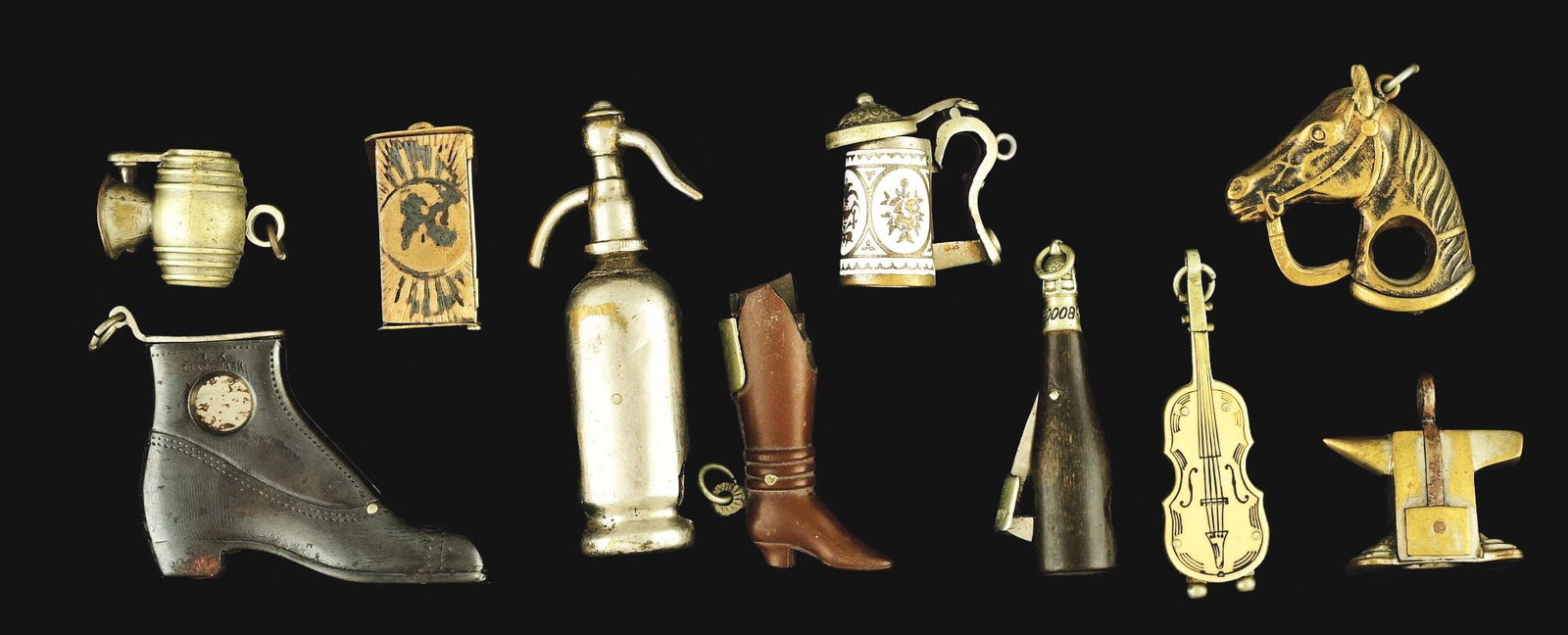 COLLECTION OF 10 VARIOUS SMALL FOB-TYPE CIGAR CUTTERS.: Collection of 10 fob-style cigar nippers. Most figural, violin celluloid, silver plate. Condition: (Very Good). Item Dimensions: Largest: 1 - 1/4" x 2 - 3/4".