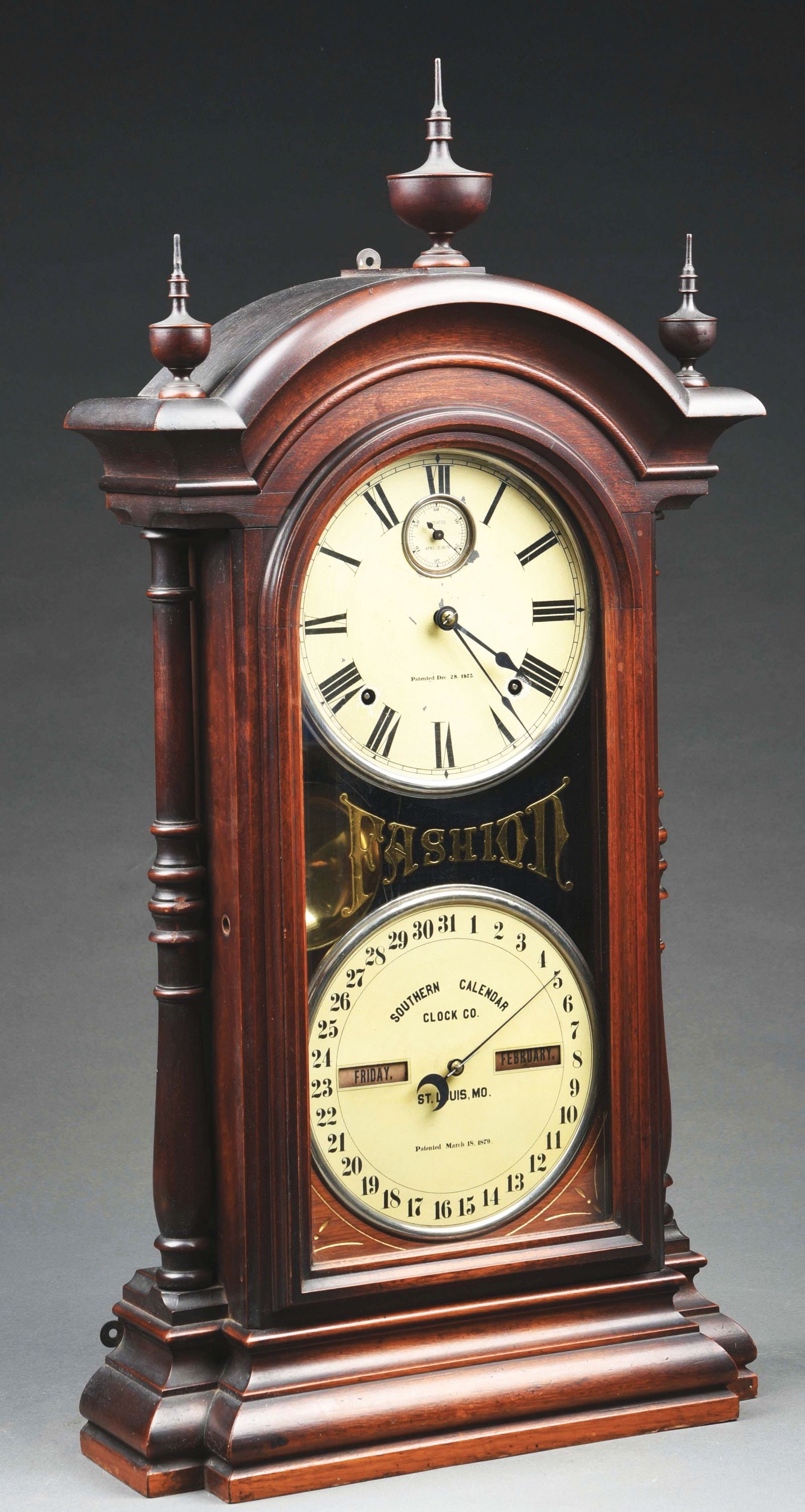 SETH THOMAS & SOUTHERN CALENDAR CLOCK CO. "FASHION #8": A double dial shelf clock with a Seth Thomas spring driven, 8-day, time and strike movement and a R. T. Andrews patented perpetual calendar mechanism in a walnut case. C. 1878. CONDITION: Showing orig