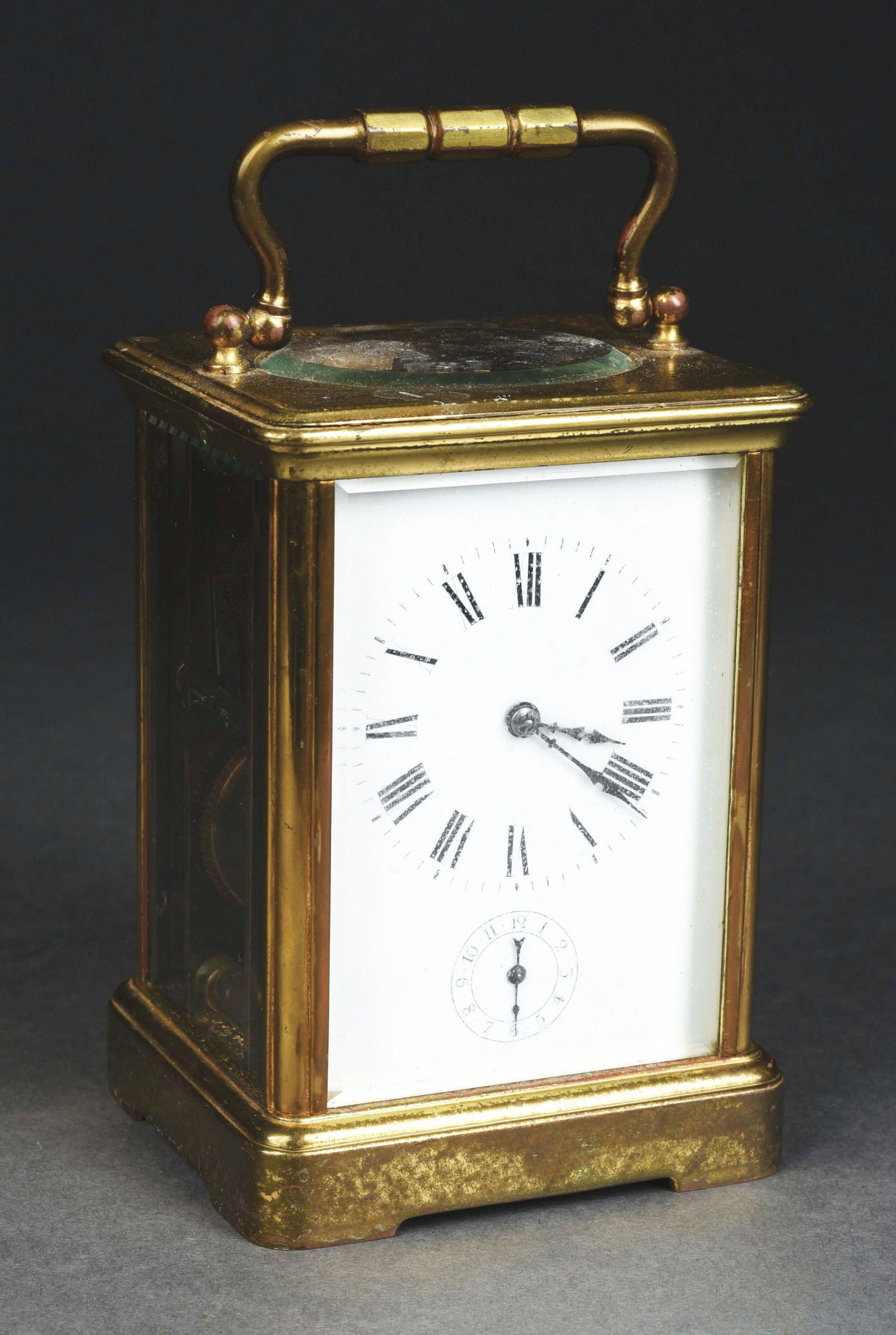 FRENCH GILT BRASS CARRIAGE CLOCK TRAVEL 8-DAY MANTEL CLOCK.: Early 20th century empire-styled gild desk clock. CONDITION: Light fade to the dial, and fully operational. A great size for a desk accessory. Condition: (Very Good). Item Dimensions: 3 - 3/4" x 3" x 