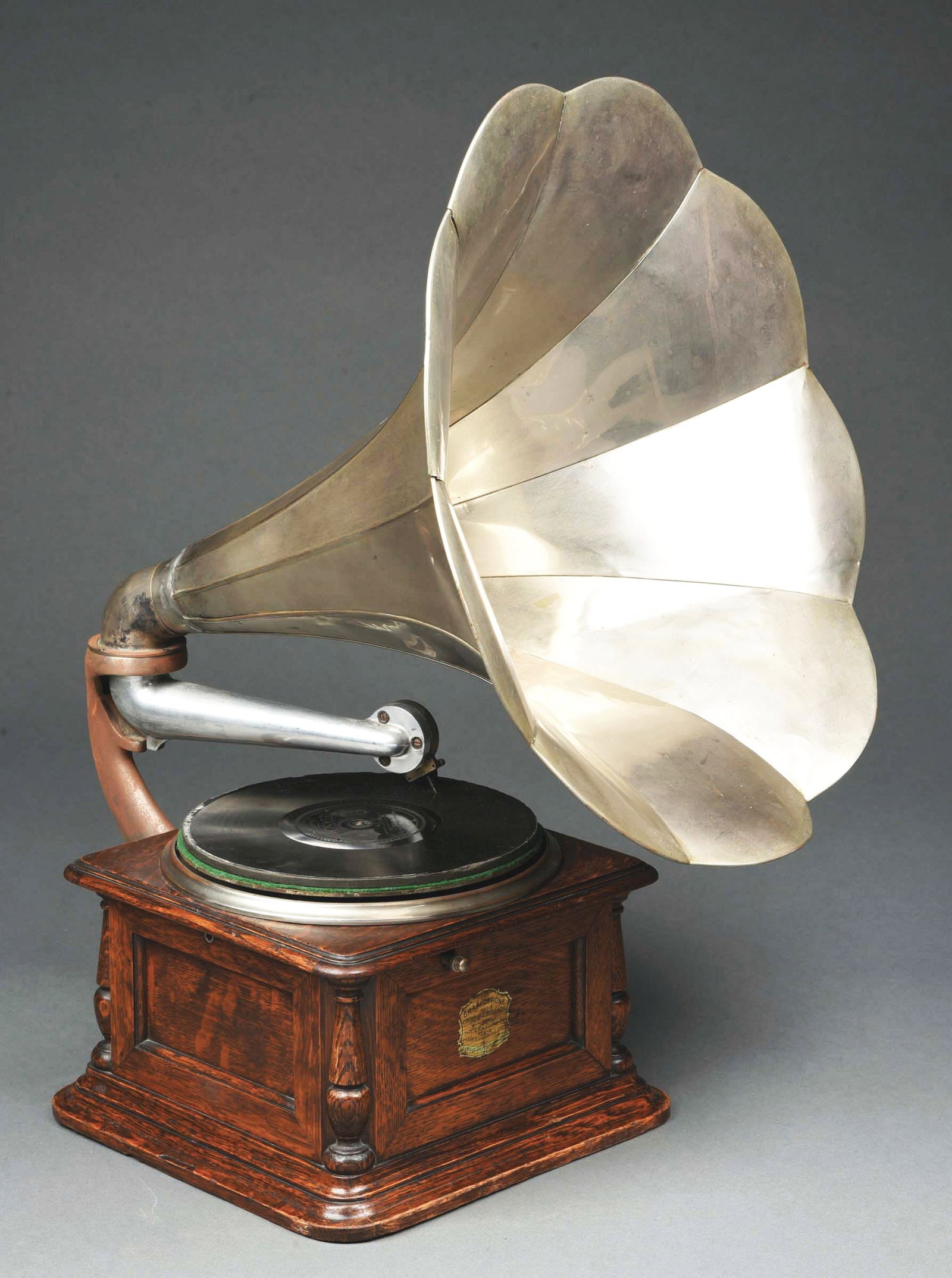 COLUMBIA GRAPHOPHONE MODEL AA WITH NICKEL HORN: Original Columbia AA Graphophone in oak with original nickel horn, felt, crank and reproducer. CONDITION: Retaining the original Columbian Expedition decal on the front, original finish, and the motor